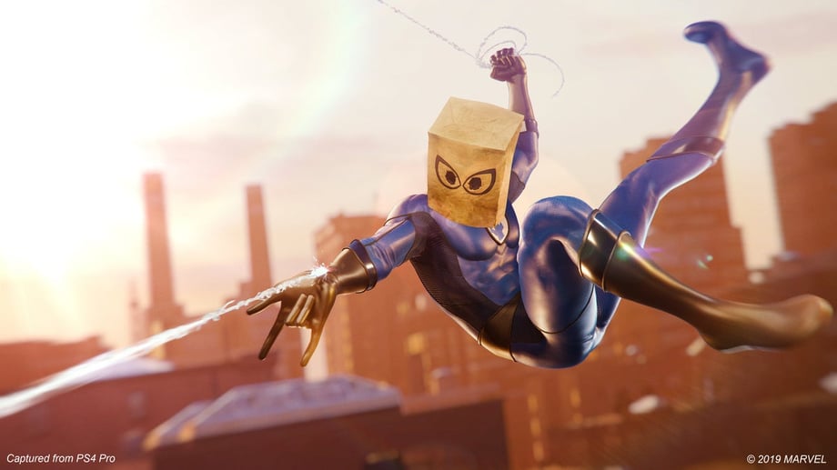 Spider-Man swings over New York in his Bombastic Bag-Man costume in a screenshot from Marvelâs Spider-Man.